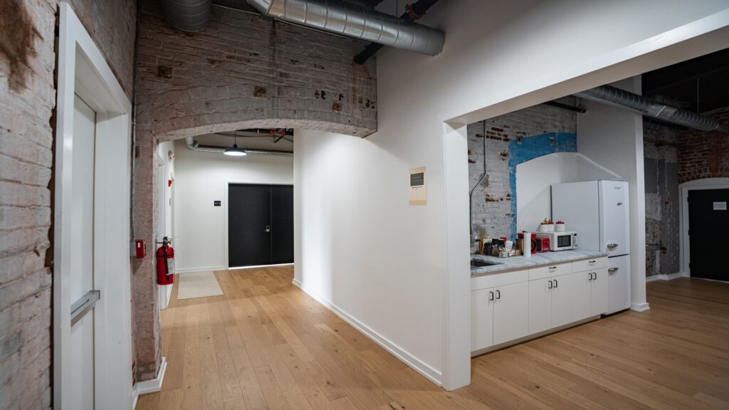Coworking space with kitchen and open workspace