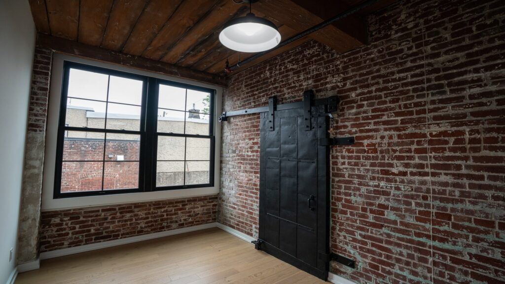 Creative coworking space with brick walls and large windows